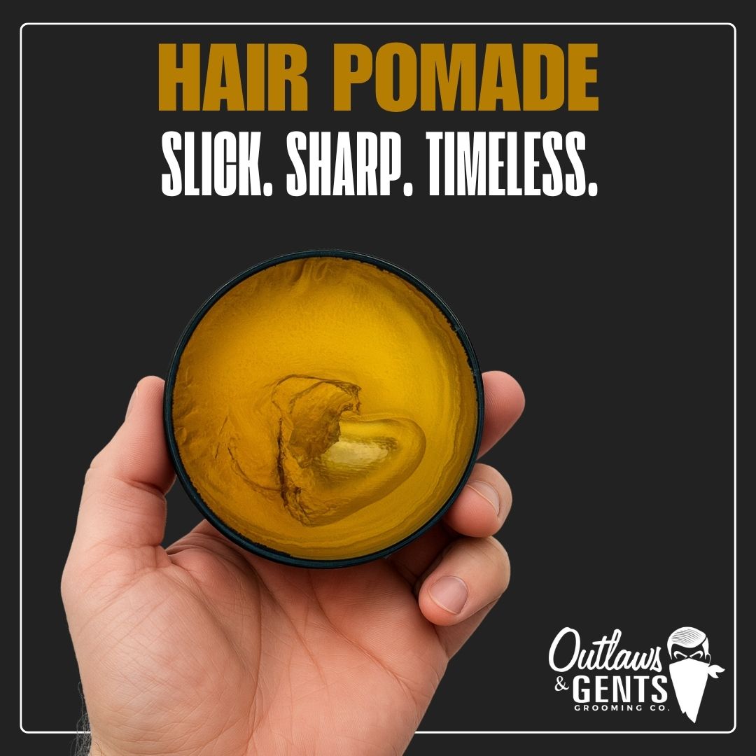 Male hand holding Outlaws and Gents hair pomade
