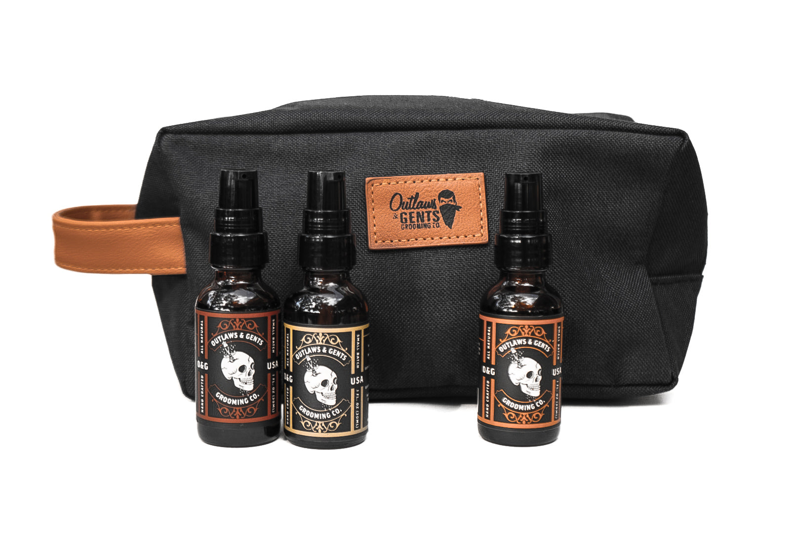 Outlaws and Gents clove and orange, pine and cedar, and orange and vanilla grooming oils with dopp bag