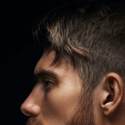 Close up of mans hair parted to the side